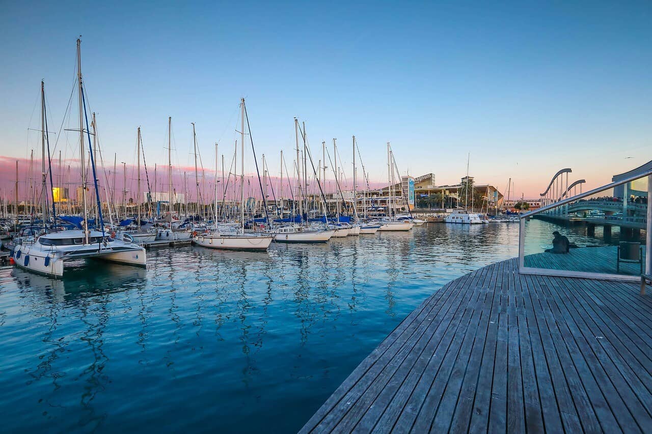 Small boat harbor in Barcelona at sunset