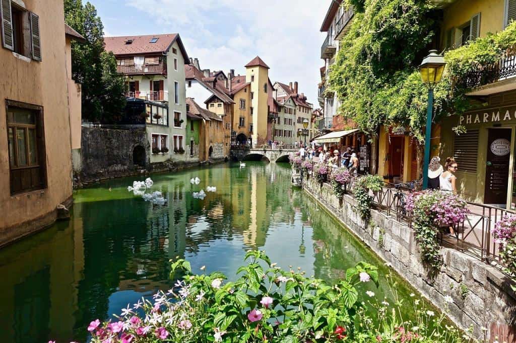 The downtown area of Lake Annecy is covered in beautiful blossoming flowers in the summer