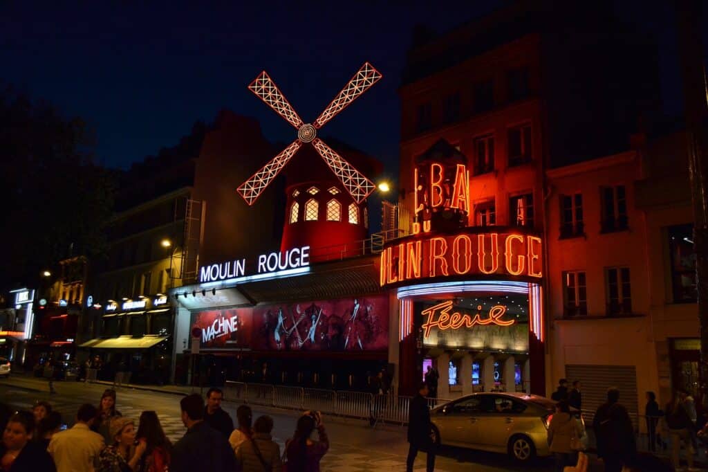 Large group of people outside the Paris Moulin Rouge
