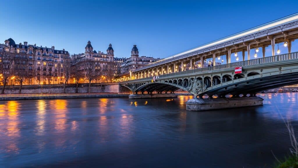 Illuminated bridge in Paris after dark