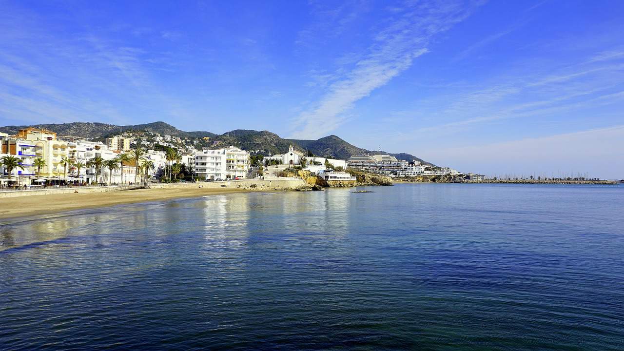 Coastal town with a beautiful beach on a sunny day in Sitges, Spain
