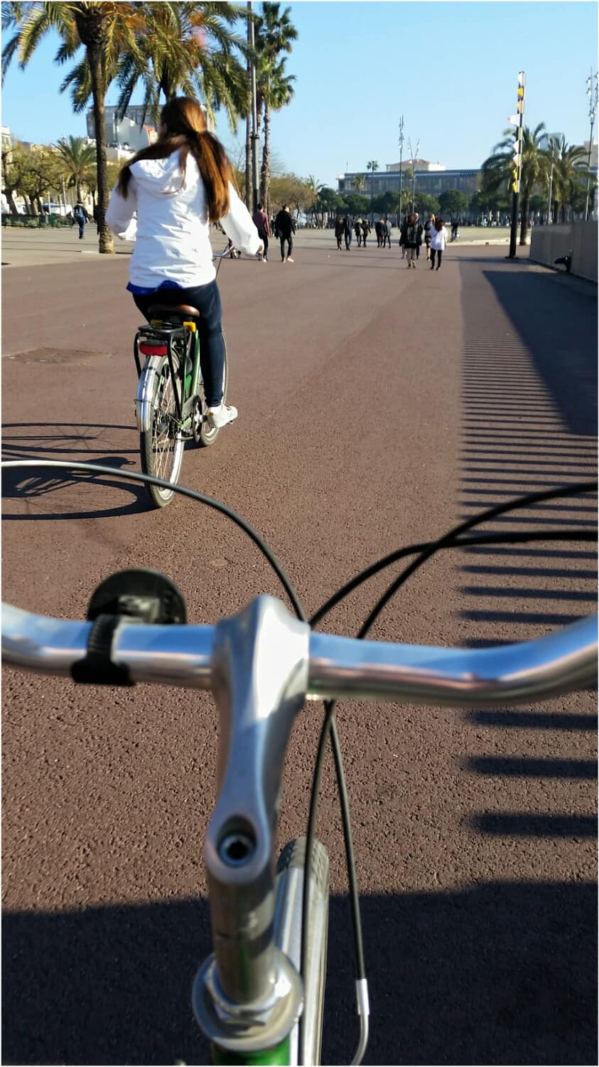 View of two people on bikes in Barcelona
