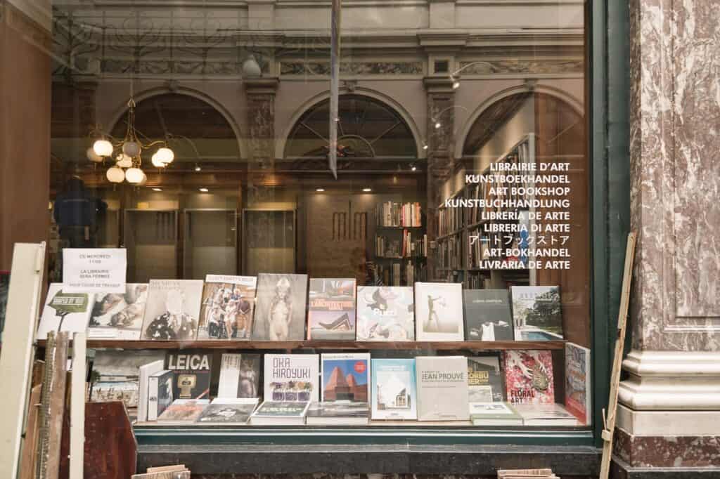 Glass front window of a bookshop with some books on display