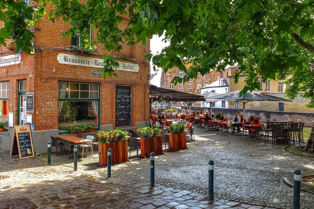Brasserie in a brick building on a cobblestone square in Belgium