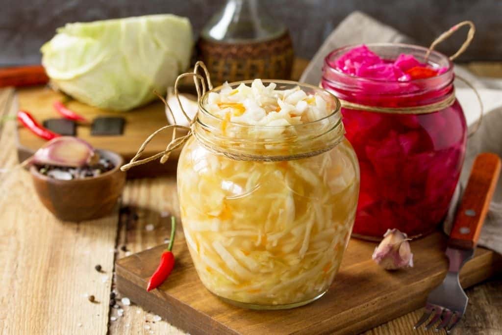 Jars of sauerkraut and pickled vegetables