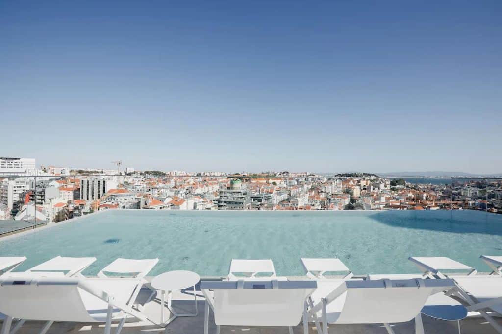 Rooftop pool in sun loungers in Lisbon