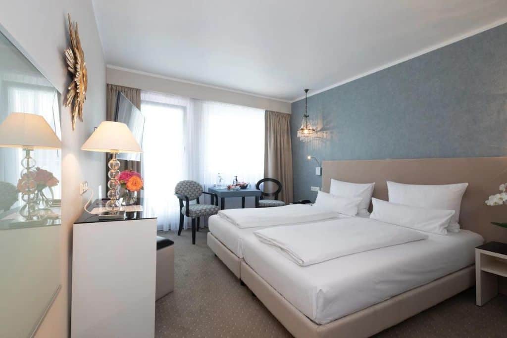 Upscale hotel room with gold and blue decor