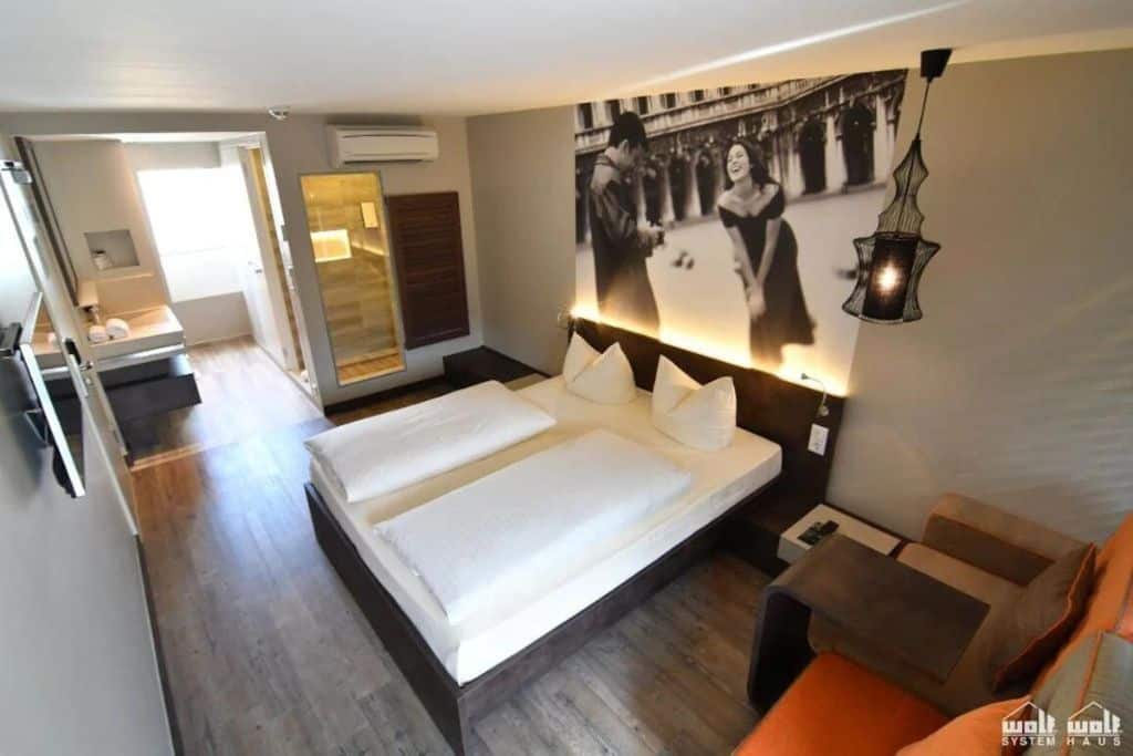 Aerial of a hotel room with a large black and white print of a couple
