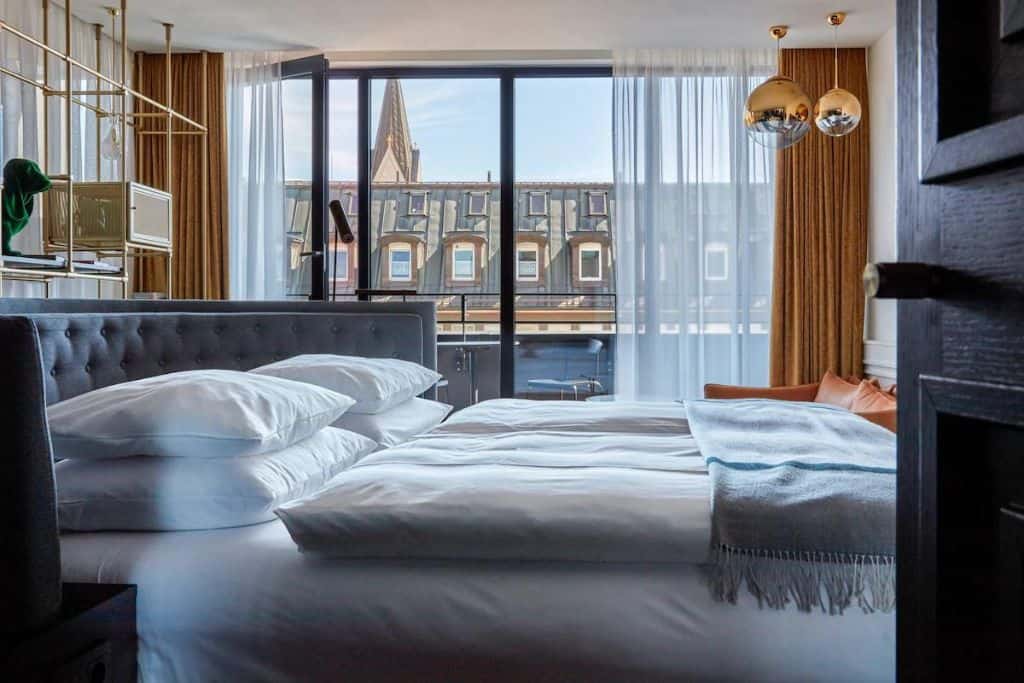Small, modern hotel room overlooking Munich