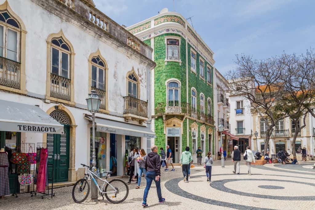 People walking around a shopping square in Portugal