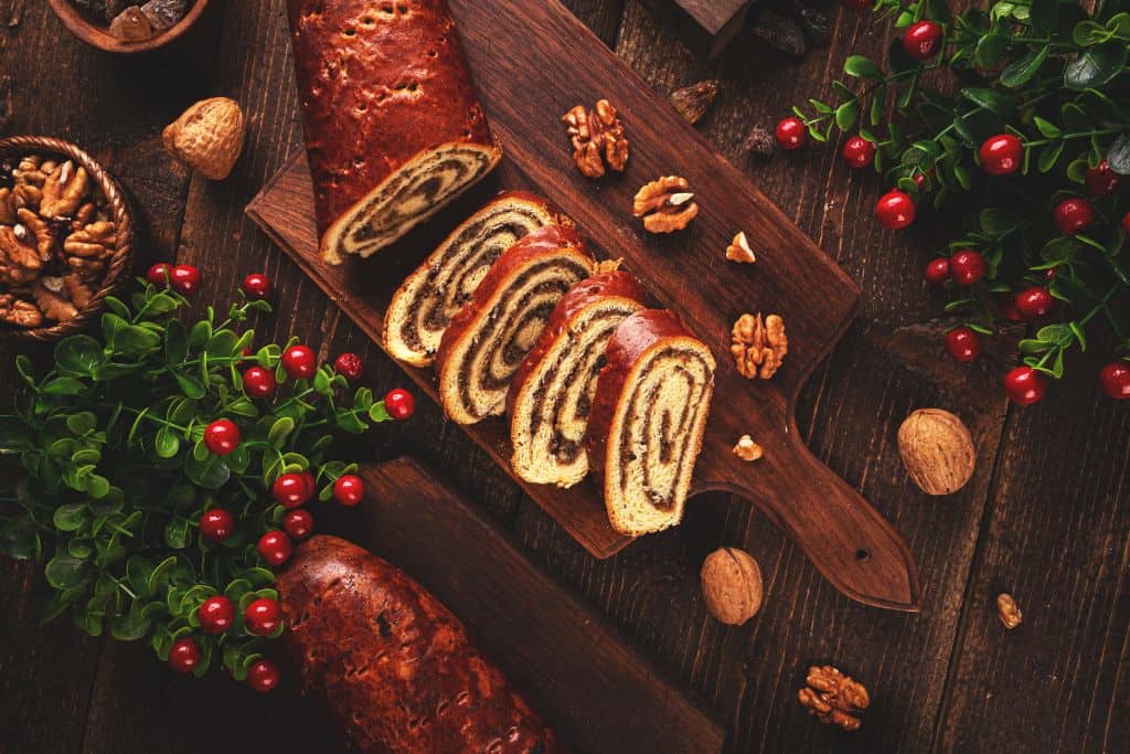 Traditional Beigli, or swirled spiced load of bread cut on a board
