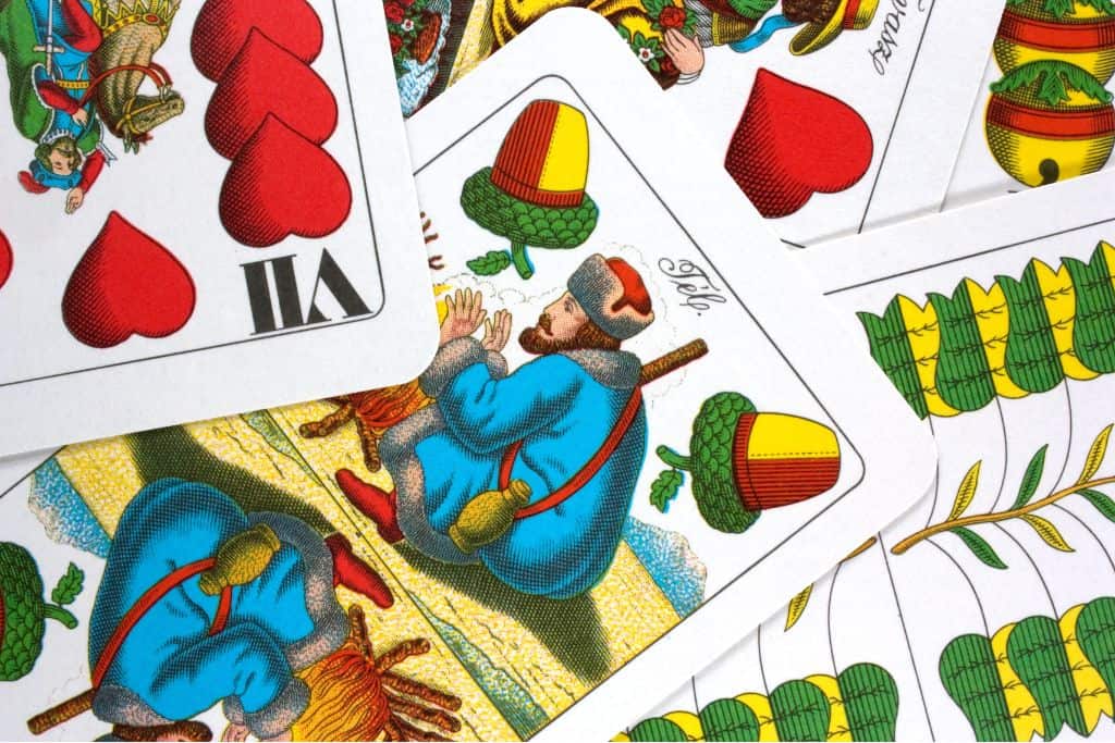 Hungarian playing cards laid out in a messy pile
