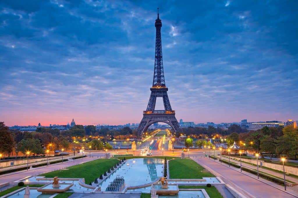 Very vibrant photo of the Eiffel Tower in Paris at sunset over the reflection pool