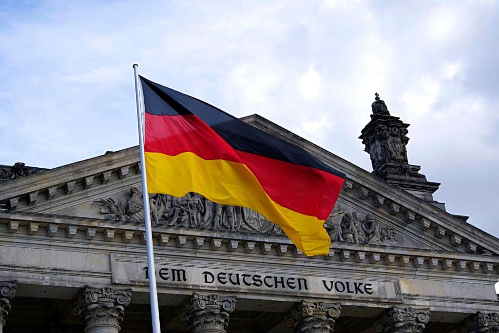 A German flag flying over a building