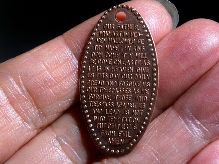Pressed penny in someone's hand