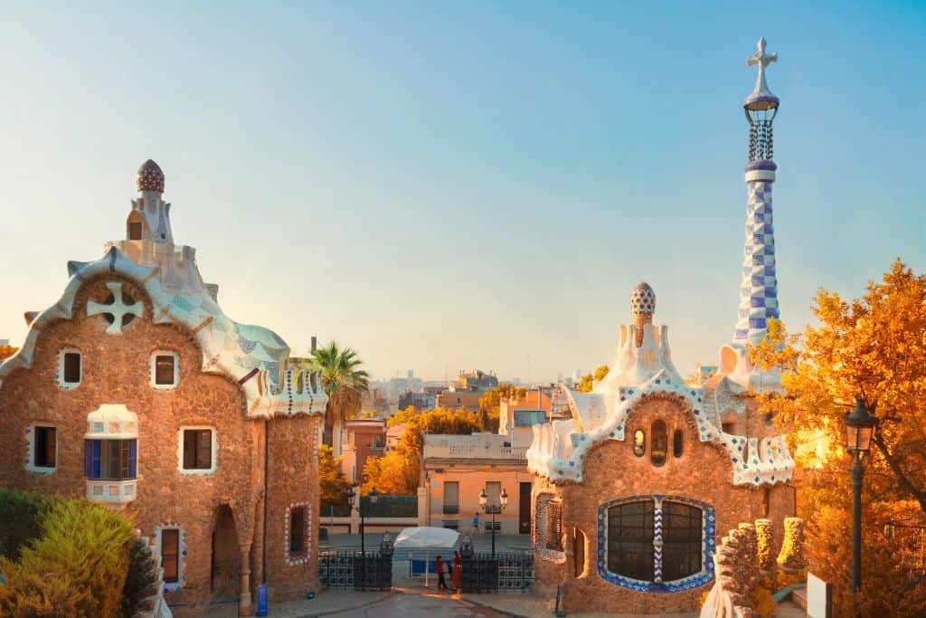 Golden sunlight shining on buildings in an empty Park Guell