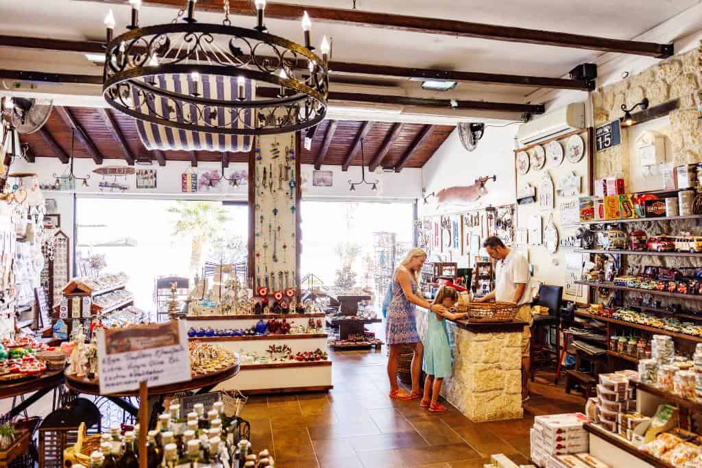 Souvenir shop with a mom and daughter at the checkout