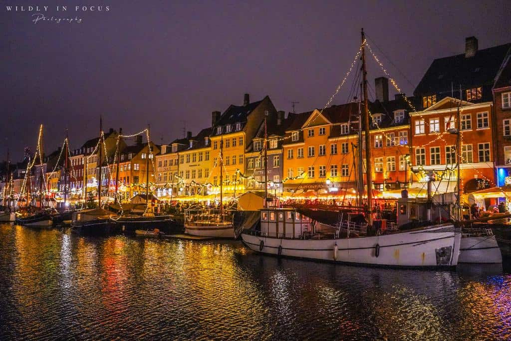 Copenhagen's Nyhavn Harbor covered in Christmas lights