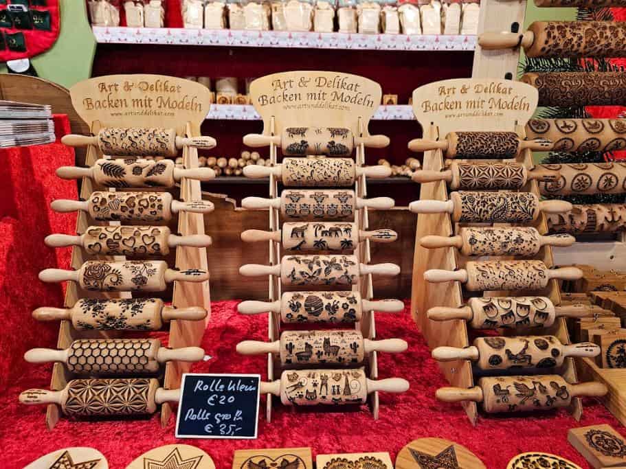 Display of wooden rolling pins with etched designs