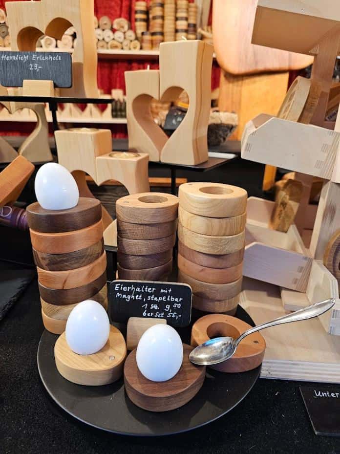 Hard boiled egg holders on display with a few eggs