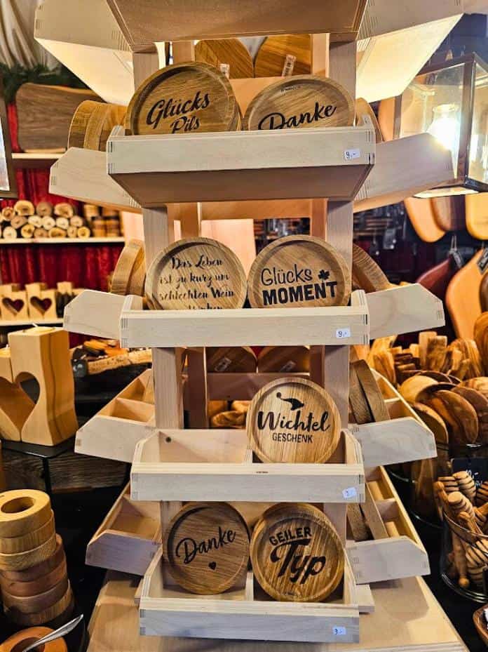 Wooden table coasters on a wooden display