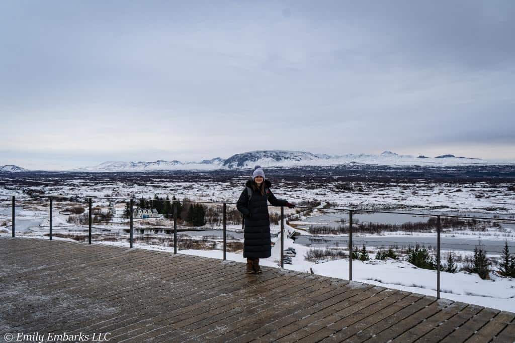 Girl in winter gear in a lookout platform in Thingvellir National Park, Iceland