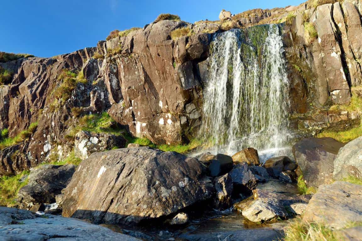The Conor Pass waterfall is one of the most scenic things to do in Dingle Ireland