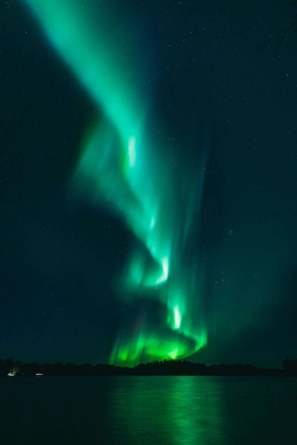 Stunning aurora borealis lights up the starry night sky over Oulu, Finland.